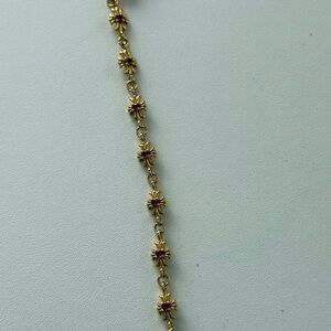 Gold-Tone Gothic Cross Bracelet with Pink Stone Accents